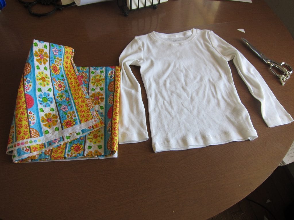 Start with a girl's long sleeved t-shirt and the fabric you like