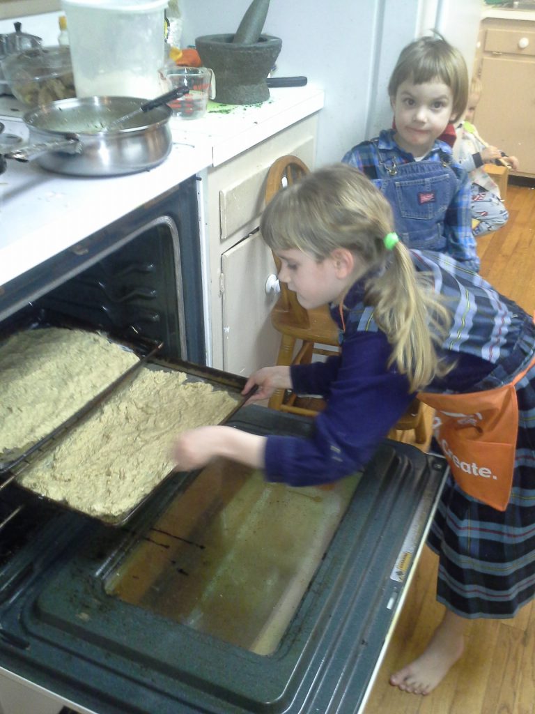 Learning to put pans in a hot oven